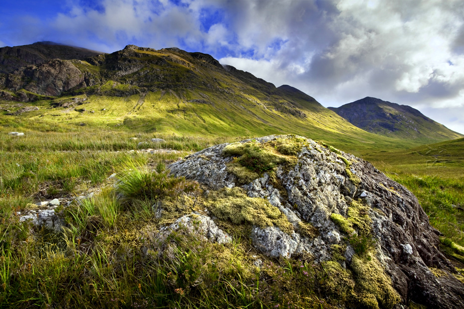 Photograph of a verdant Etive Mor on a sunny afternoon under blue sky