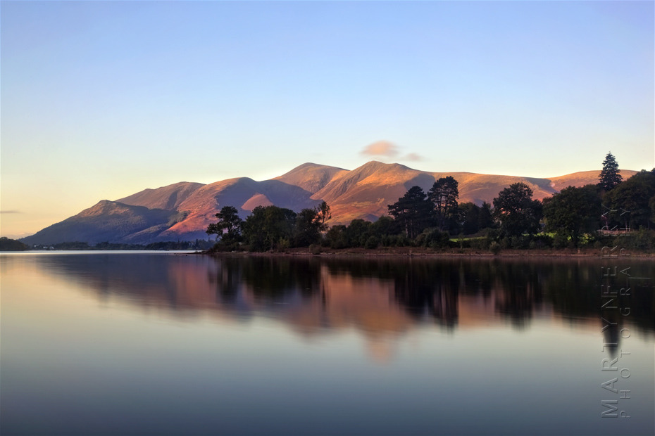 Derwentwater at sunset with calm reflection