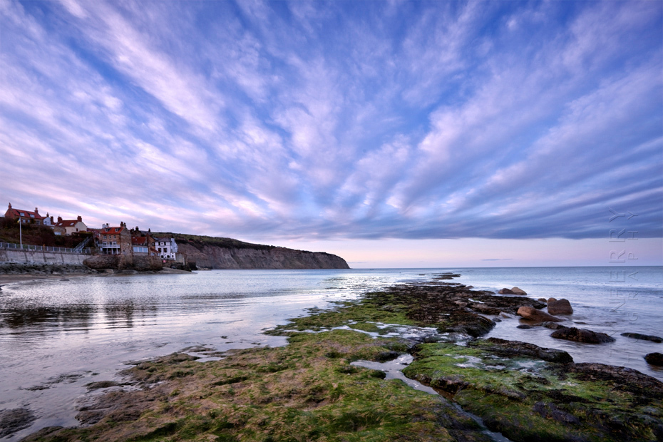 Striking image of clouds above Robin Hoods Bay in North Yorkshire at sunset