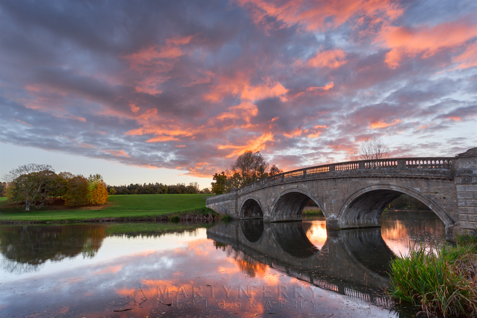 Beautiful sunset colours over a bridge at Blenheim Park in Oxfordshire