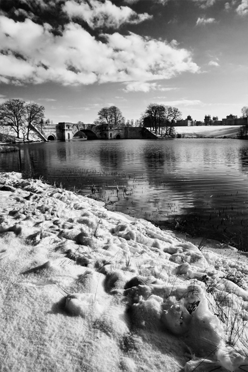 Black and white image of Blenheim Palace park under a covering of snow