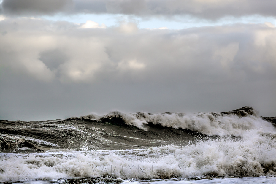 Stormy waves under clouds at Whitley Bay