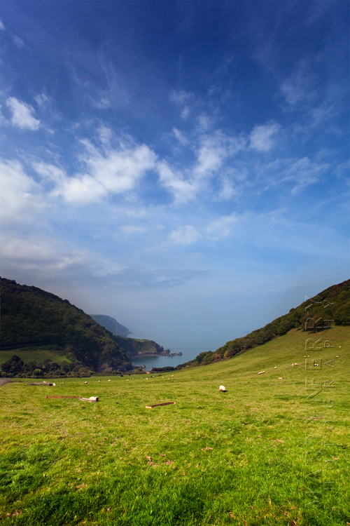 Beautiful view down to Lee Bay under a blue sky