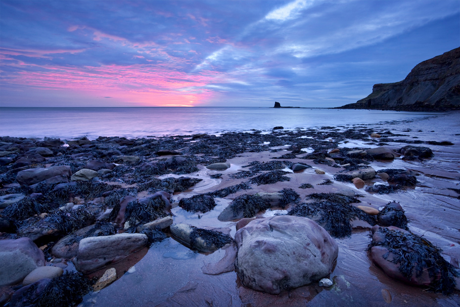 Stunning landscape image of Saltwick Bay at sunrise
