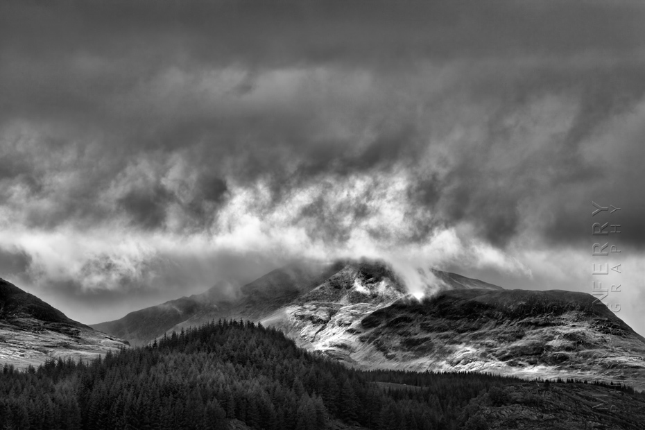 Black and white landscape photo of the Cairngorms under stormy skies