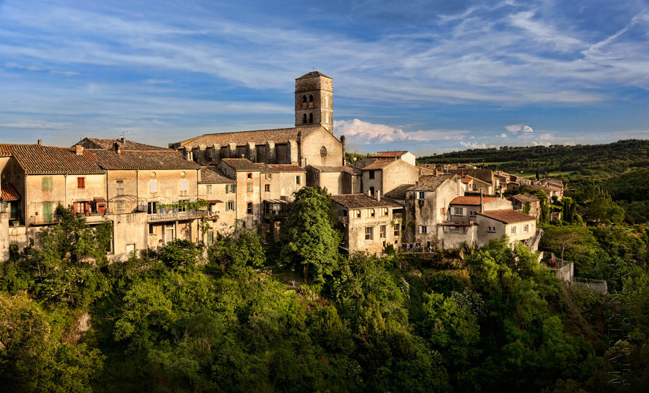 Beautiful warm light on ancient Montolieu church