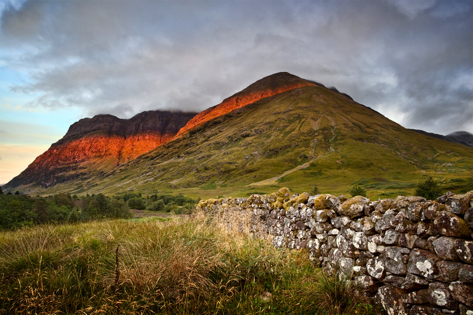 Beautiful image of sunset light on the flanks of the Three Sisters in Glen Coe