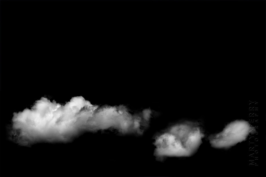 Fine art photography of clouds floating in black nothingness