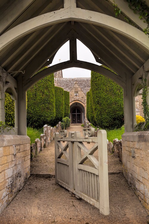 Gate of St. Peter's Church in the Cotswold village of Duntisbourne Abbots