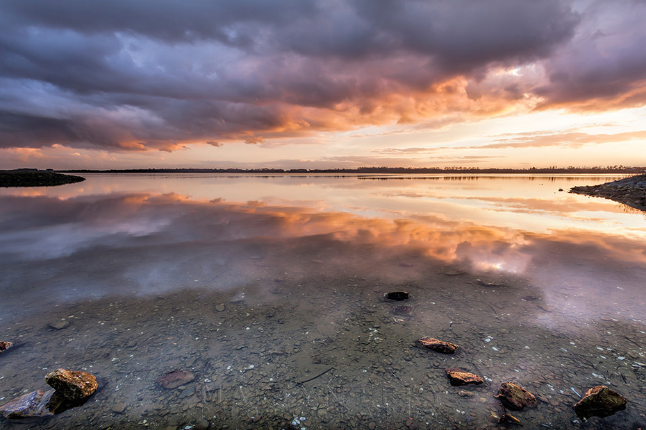 Storm clouds reflect in the lake at Grafham Water