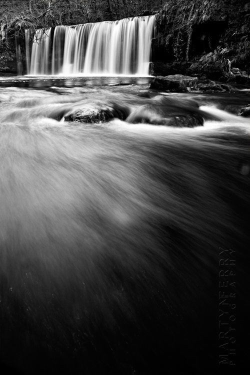 Striking black and white photograph of Upper Gushing Falls