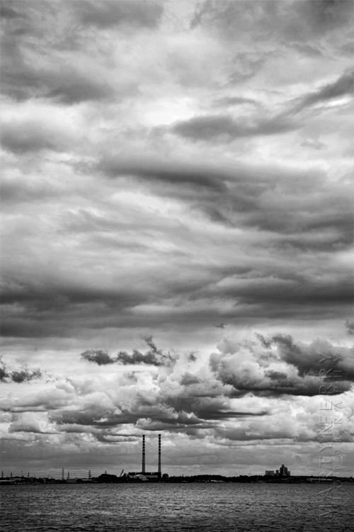 Image of distant power plant and dramatic skies
