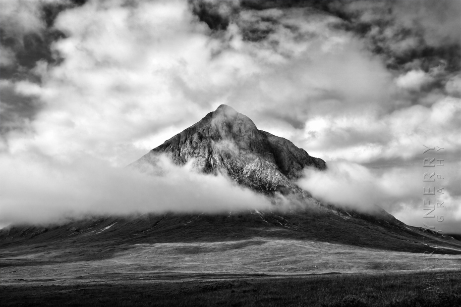 Impressive photograph of Buachaille Etive Mor surrounded by clouds