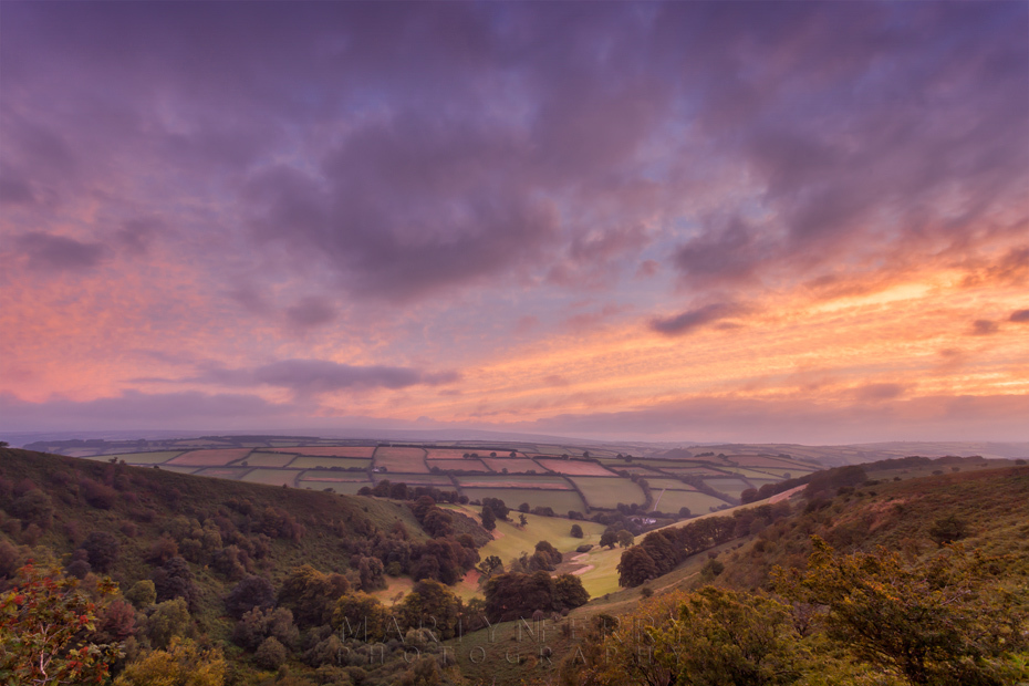 Colourful sunrise image of The Punchbowl from Winsford Hill