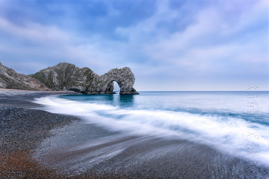 Waves on the beach at Durdle Door on the Dorset coast