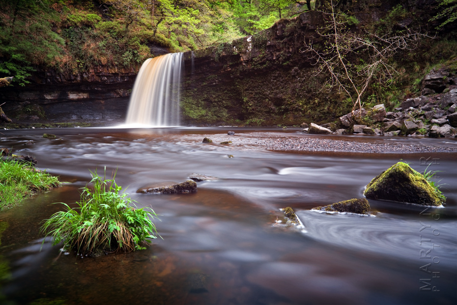 Landscape image of Welsh waterfall in Spring