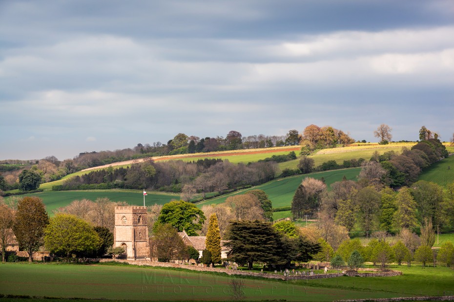 Guiting Power church and surrounding landscape in the Cotswolds