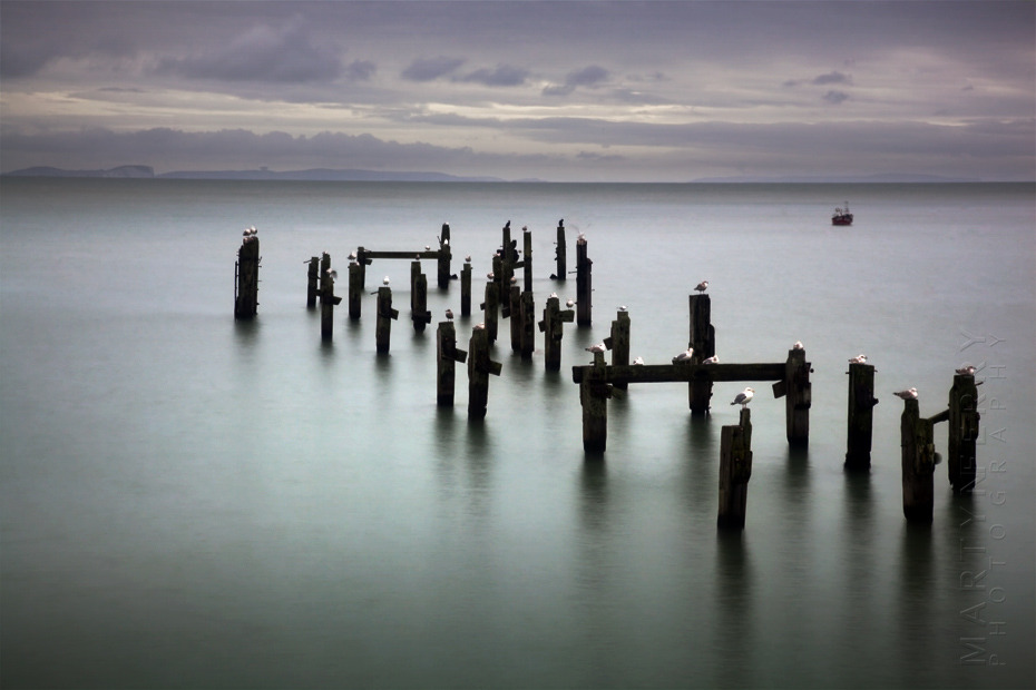Seascape image of pier ruins at Swanage