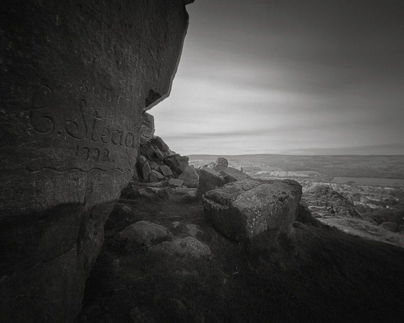 Black and White Picture of the rocks and Carvings on Cow and Calf Rocks Ilkley Moor