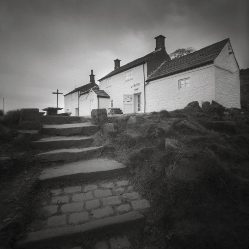Black and White photograph  of White Wells Cottages on Ilkley Moor