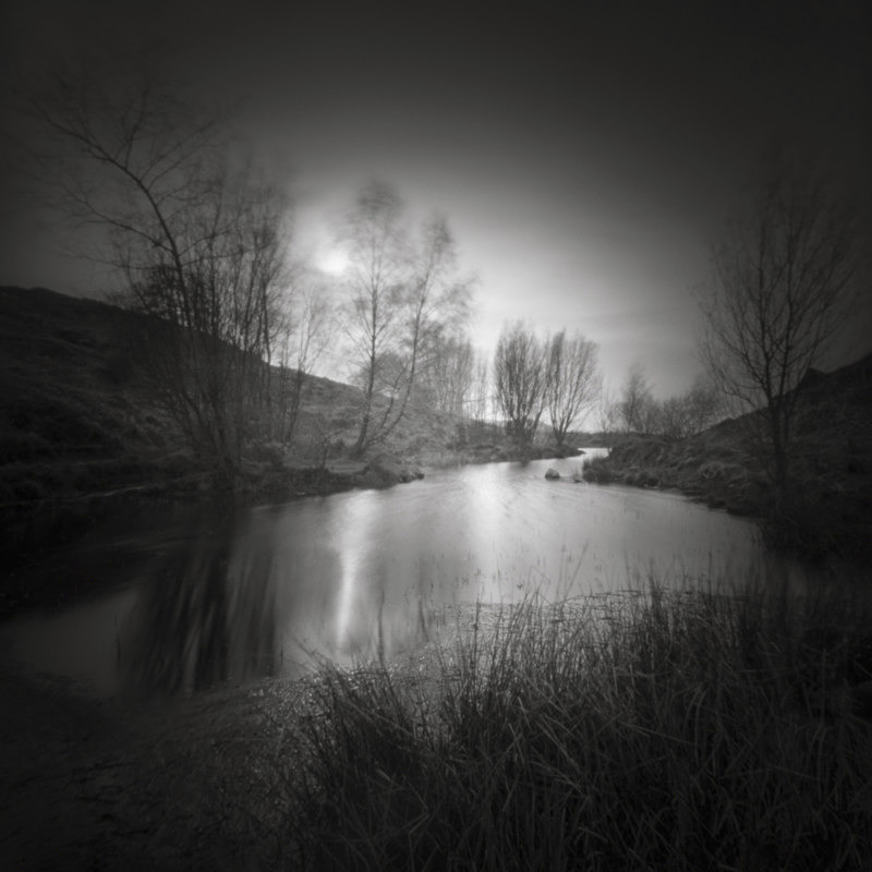 Black and White photograph of a Tarn on Ilkley moor