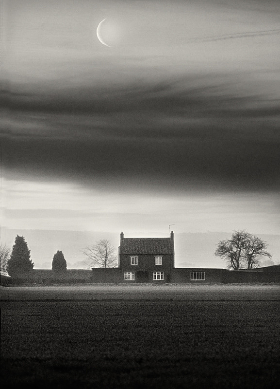 Black and White Farm house under crest moon