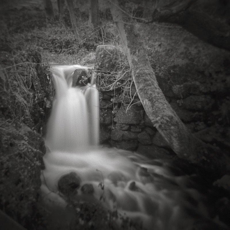 Black and white Photograpth of a small waterfall on Ilkley Moor