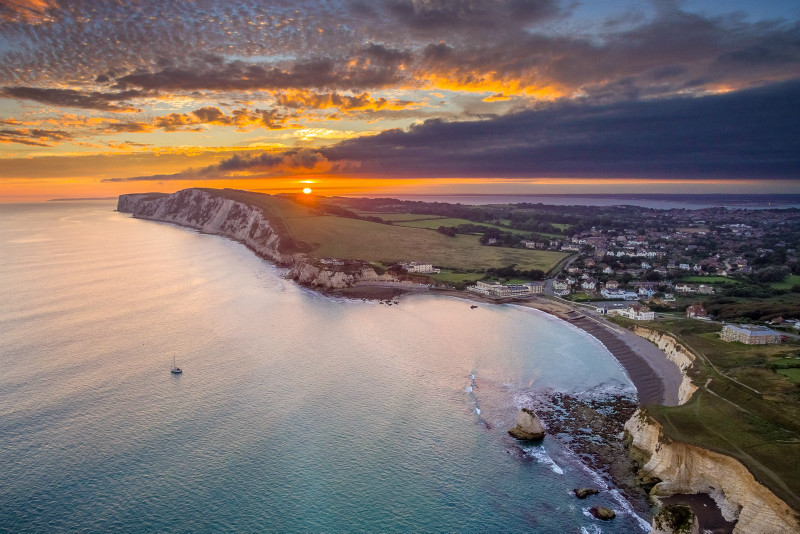 z2953 View from above Freshwater Bay at Sunset - 'Aerial Visions Photography' showing the beautiful IOW from the air