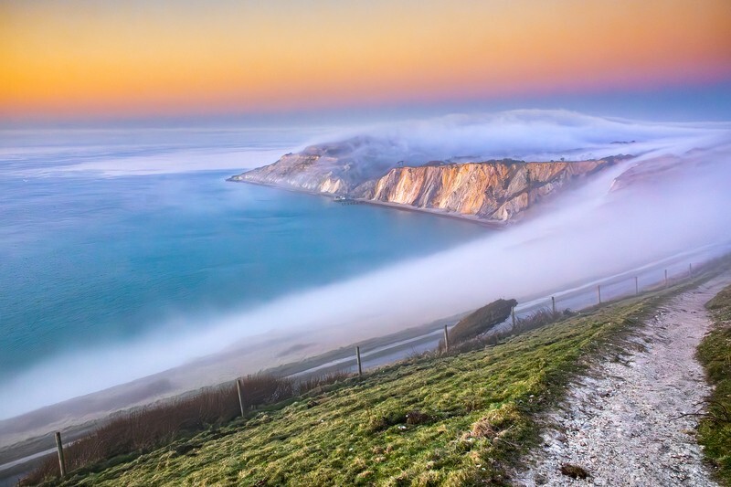 z4360 Evening Fog over Alum Bay - Freshwater Bay to Colwell Bay inc the Needles