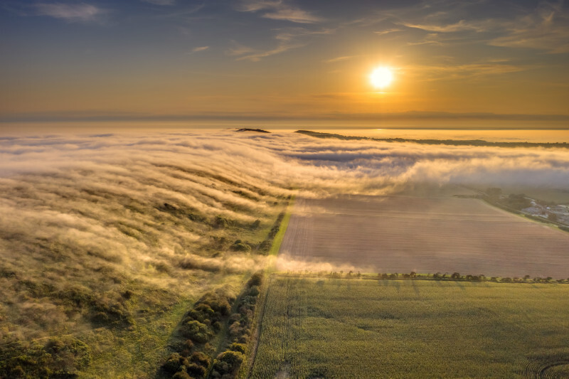 z3492 Flowing Fog over Compton Down - 'Aerial Visions Photography' showing the beautiful IOW from the air