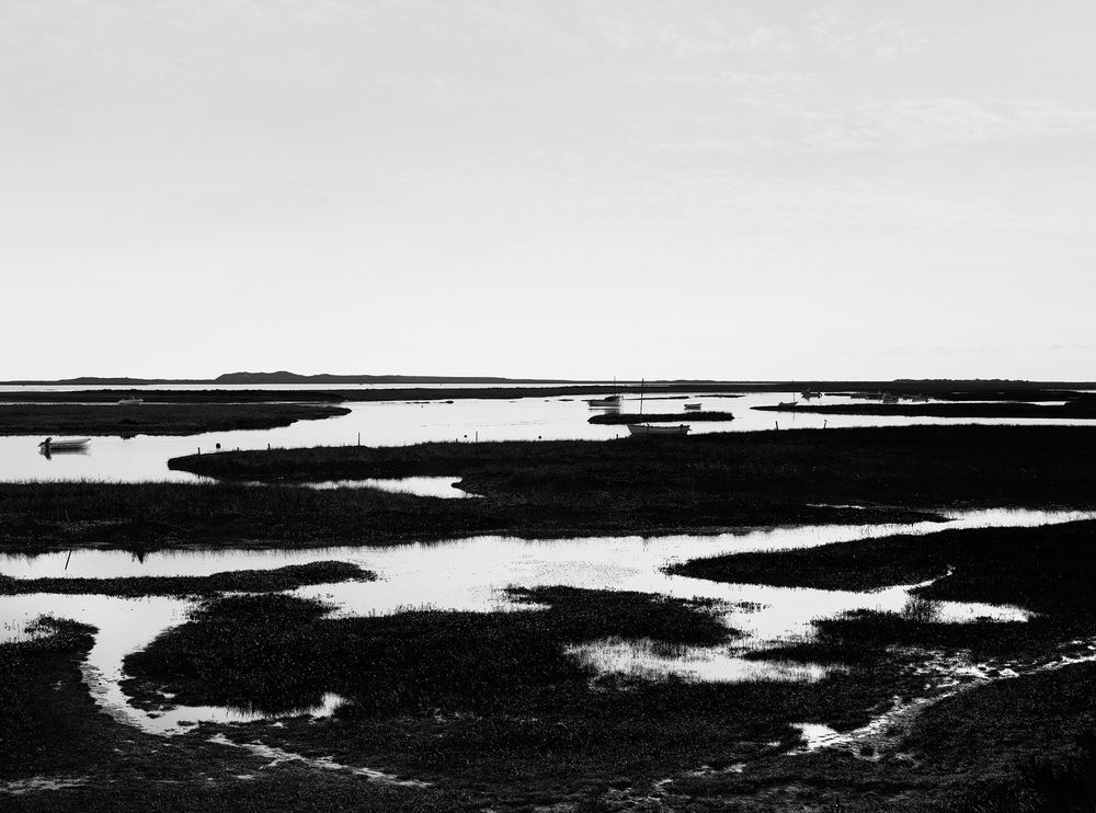 Limited edition photograph of the flooded salt marshes on the North Norfolk coastline titled “Saltmarsh Silhouettes” at Brancaster Staithe