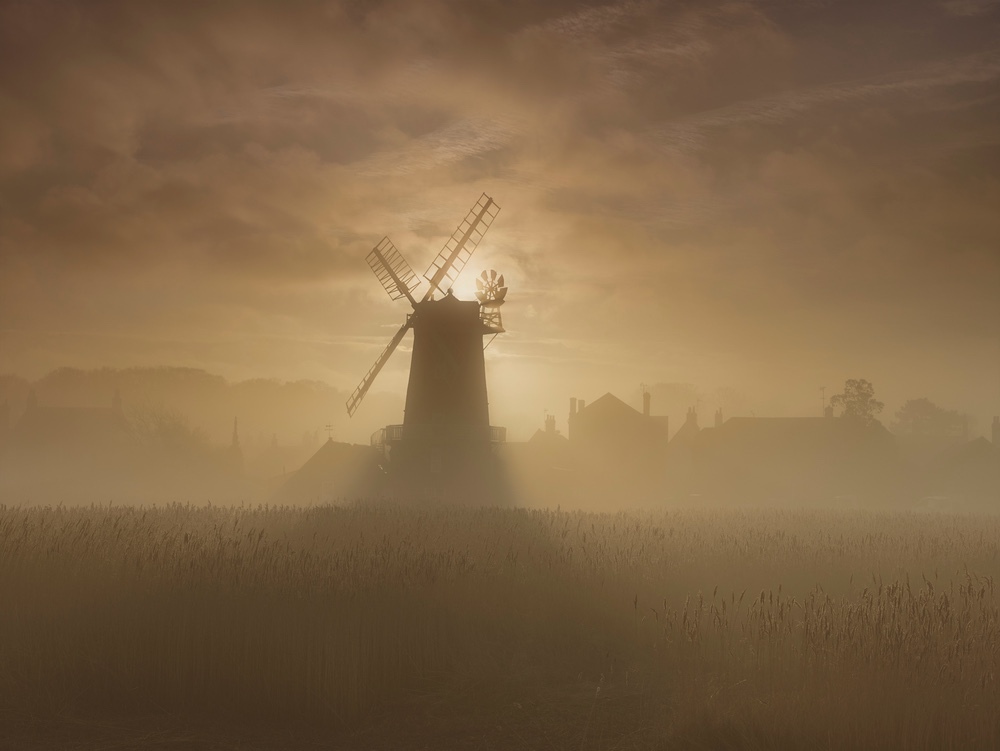 Limited edition photograph along the North Norfolk coastline titled “Mill in the Mist” at Cley-next-the-Sea”