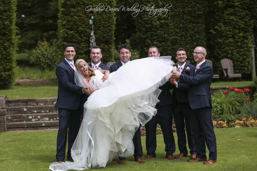 Miskin Manor Groom & ushers holding Bride - Wedding Photography at Miskin Manor