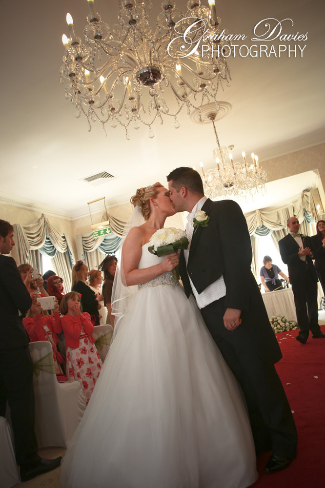 First Kiss Bride & Groom at Wedding Ceremony in De Courceys, Cardiff - Wedding Photography at De Courceys, Cardiff