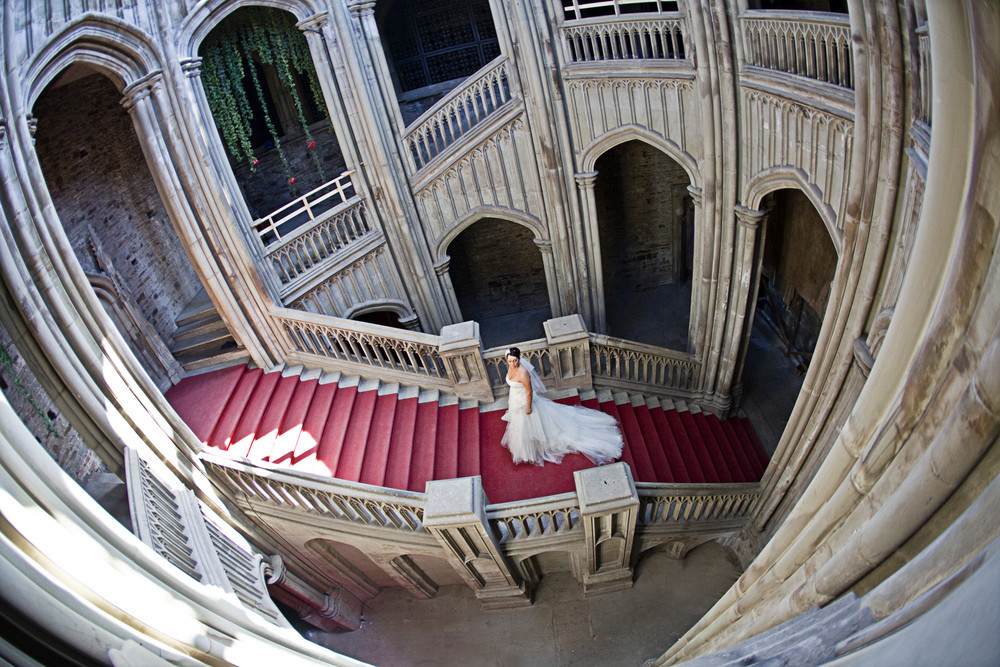 Bride on stairs at Margam Orangery (inside Margam House) - Wedding Photography at Margam Orangery