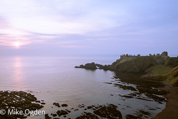 Dunnopttar Castle at dawn, across Castle Bay - Dunnottar Castle