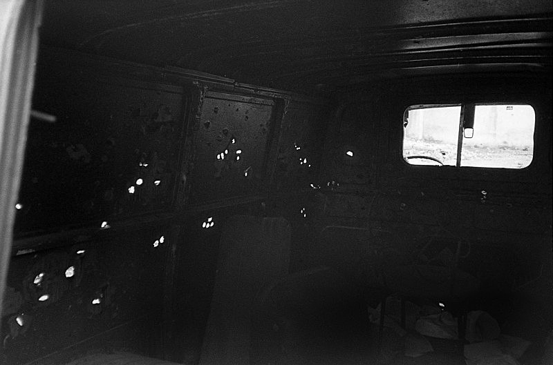 Bullet holes in van, Bucarest, Romania - From the book Mellomspill (Between the Acts) A Central European Trip.  1991